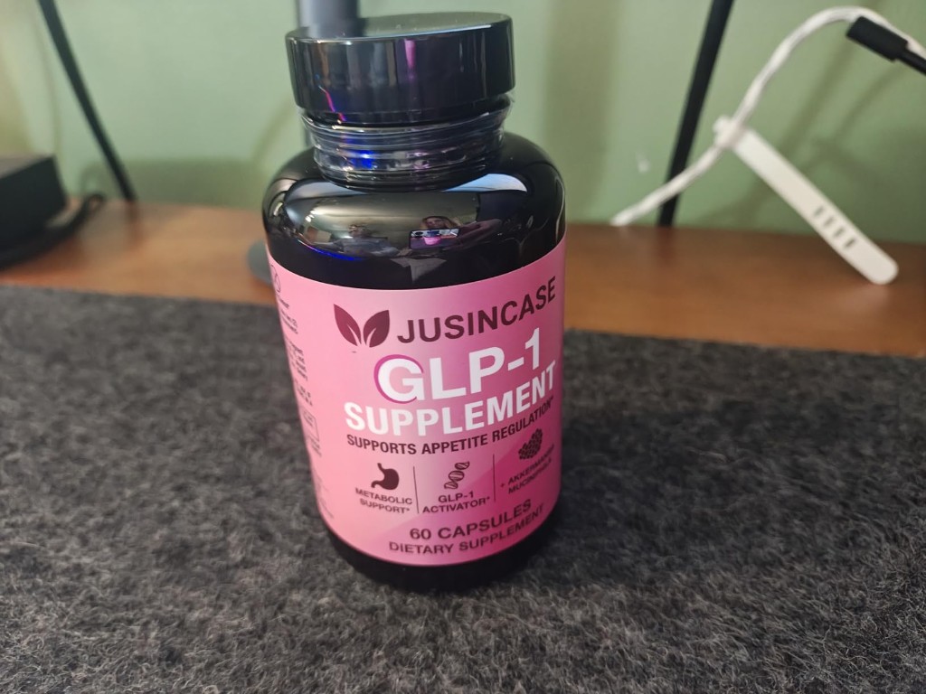 Close-up of the JUSINCASE GLP-1 Supplement bottle
