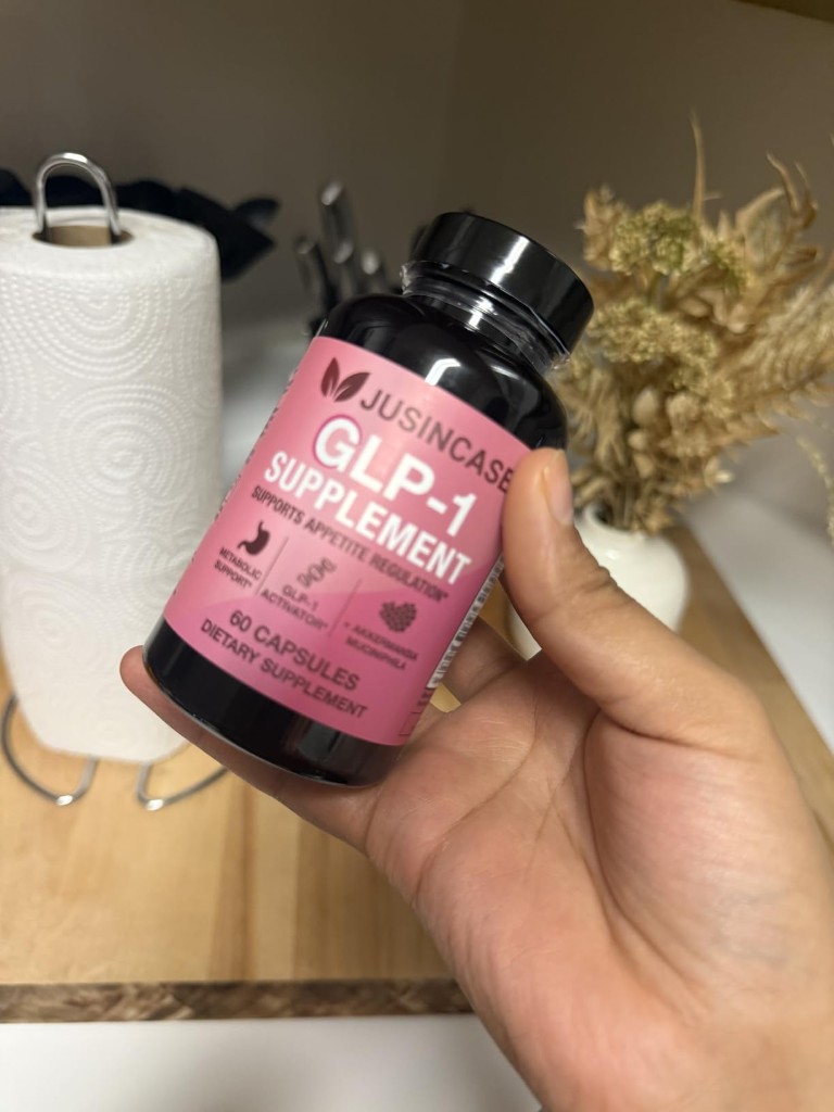 Customer holding the JUSINCASE GLP-1 Supplement bottle